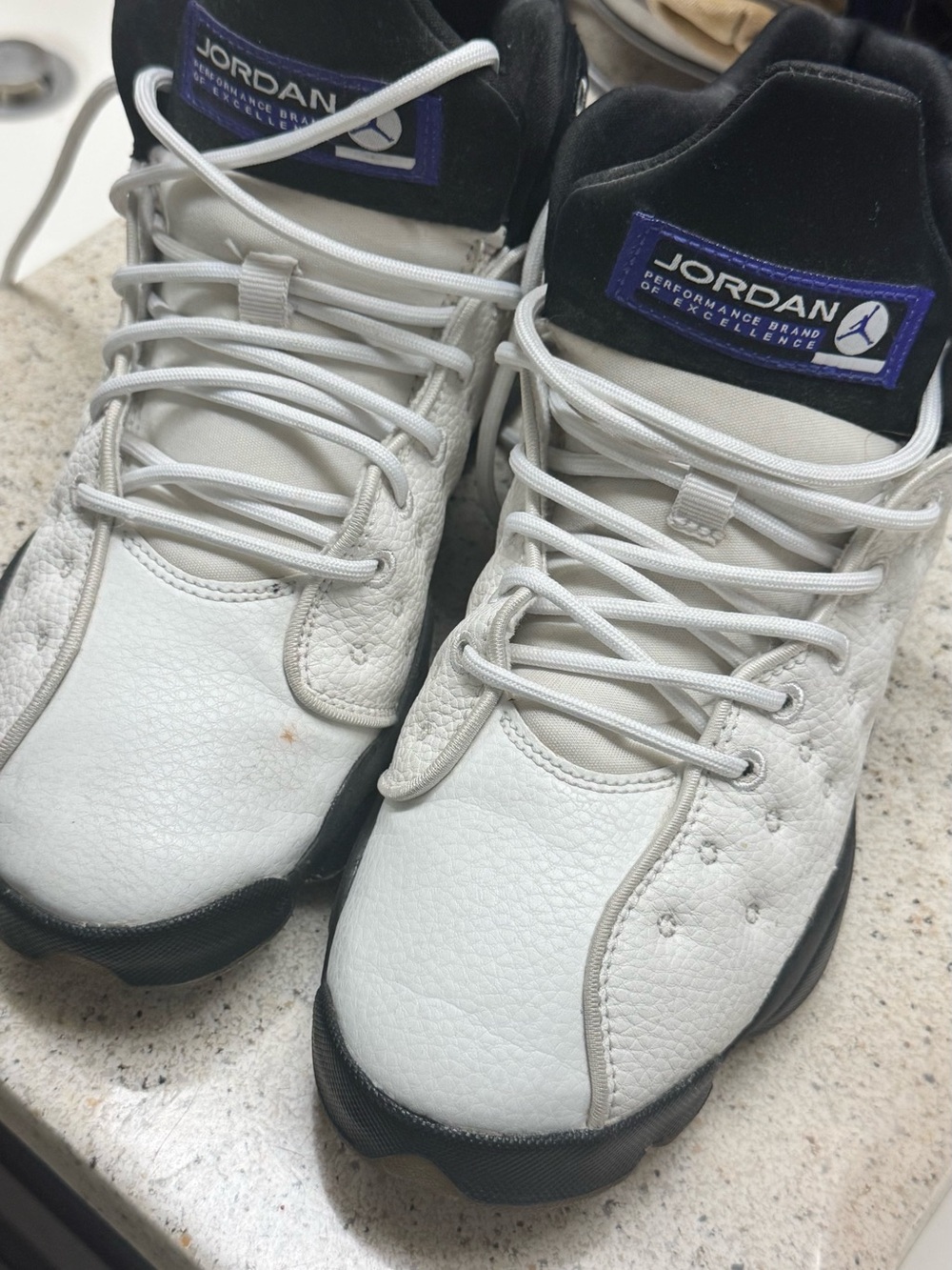 Jordan Retro Athletic Shoes in White, Black and Purple Accents
